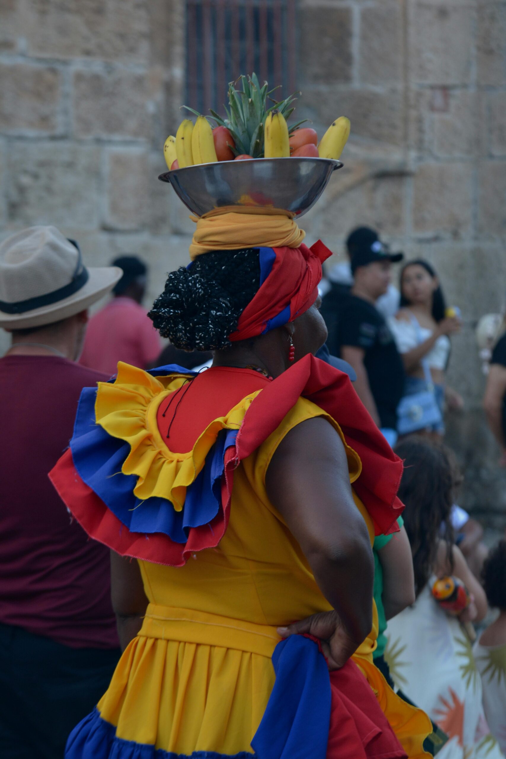 Colorful traditional costumes at a lively Colombian festival parade.