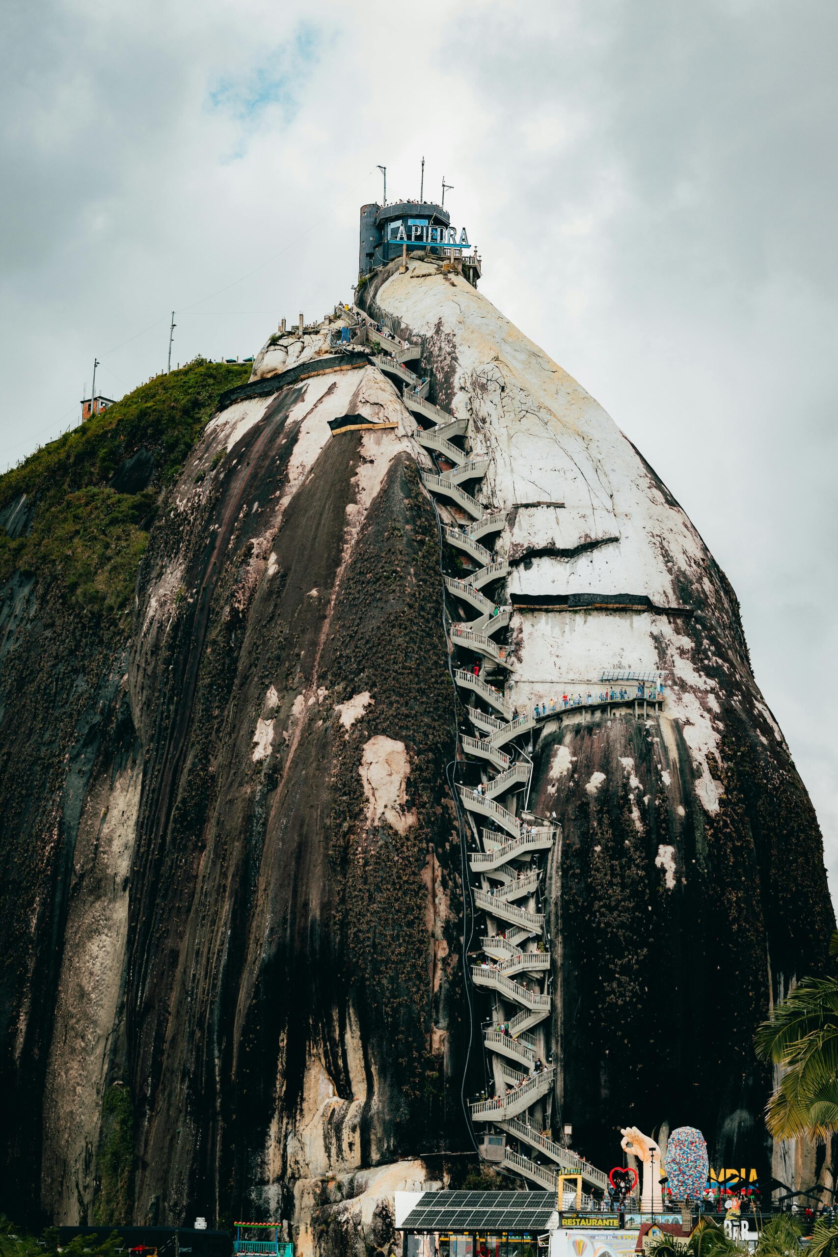 View of the iconic rock formation and staircase at El Peñol in Colombia.